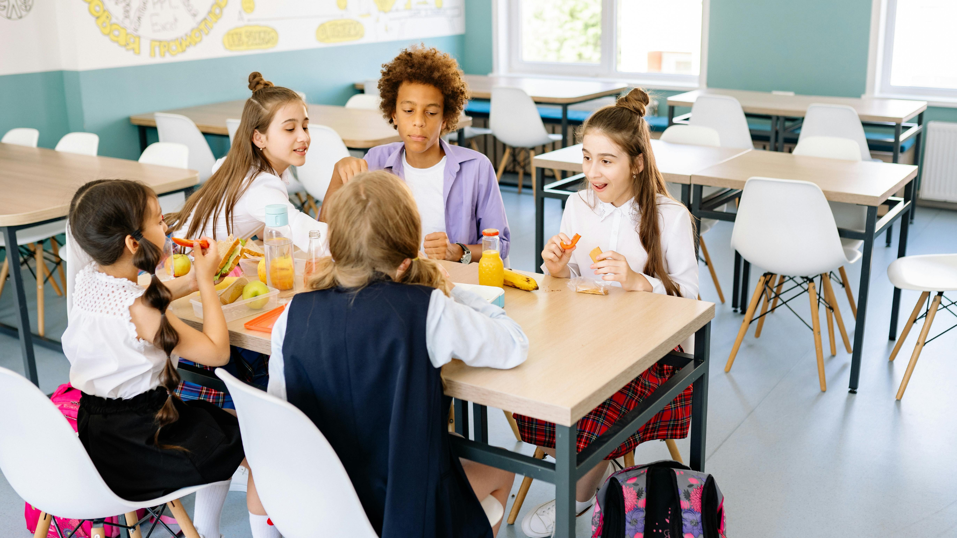 A group of middle school students eating lunch at school