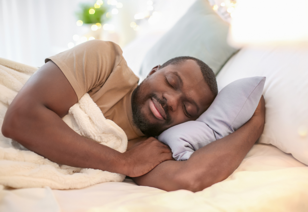 A man sleeping soundly on a comfy bed